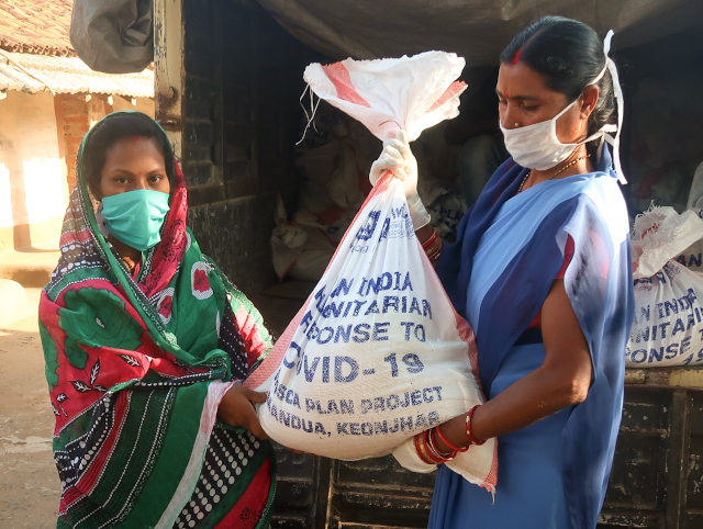 Women receives food kit in Odisha state.jpg