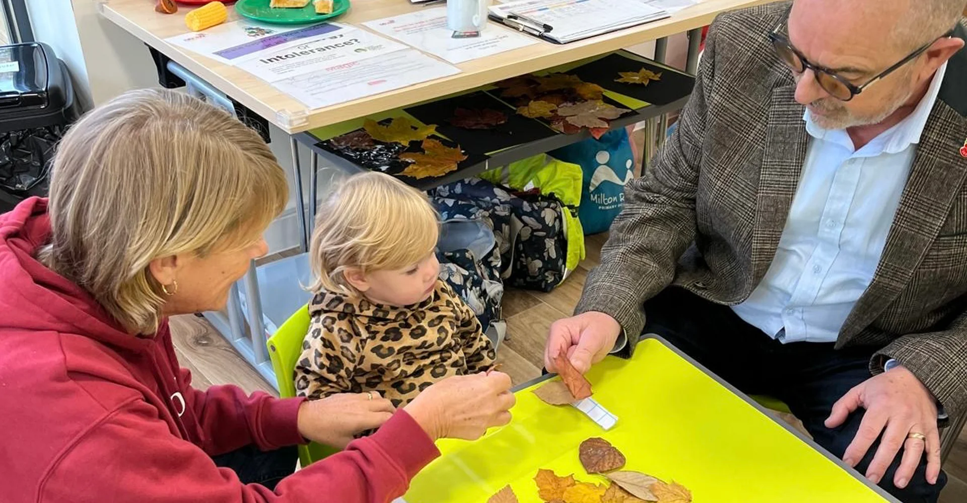 Cambridgeshire Freemason, Tony Barrios, enjoying a craft session with a parent and child