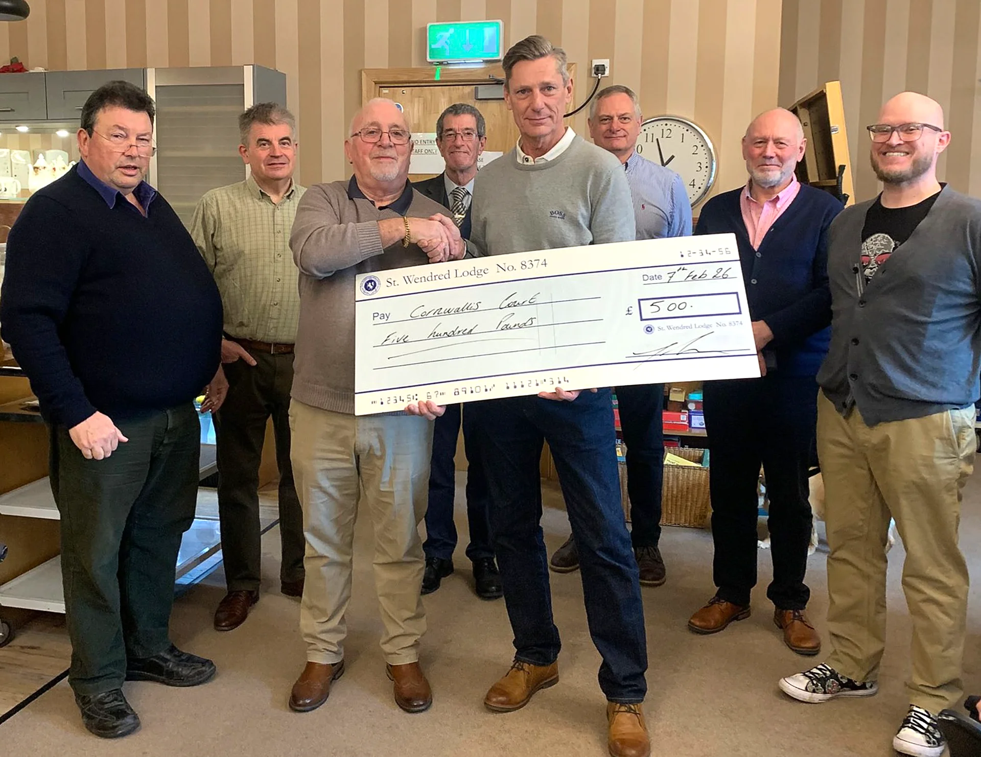 W.Bro. Tom French presenting a cheque for £500 to Roger Flory